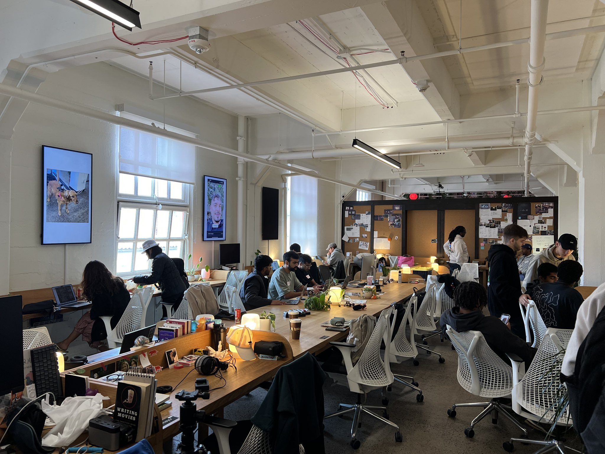 Builders working together in a shared workspace during an AI event